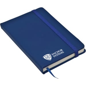 A navy pocket pad with a purple elastic band and a bookmark. It features a logo on the front cover.