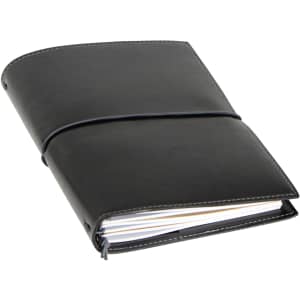 A black A5 journal with a flexible cover, featuring an elastic closure and visible pages. It has a logo on the front.