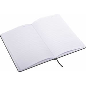 An A5 notebook with a black cover and lined pages, featuring a ribbon marker and an internal logo.