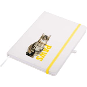 A white A5 notepad with a yellow elastic band, featuring a cat graphic and the word "PAWS".