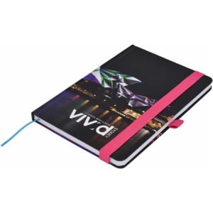 A5 notebook with a colourful geometric design on the cover, featuring a pink elastic band and blue ribbon marker.