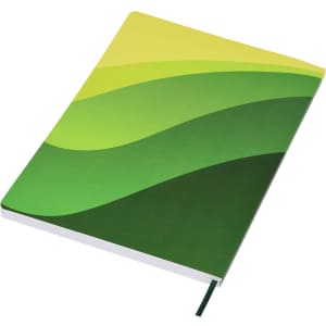 A green and yellow patterned A5 notebook with a soft cover and an attached ribbon bookmark, featuring a logo.