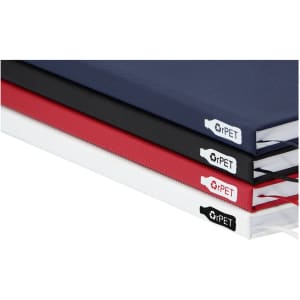 A collection of A5 notebooks in navy, black, red, and white, featuring branding on the spines.