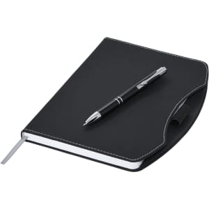 A black A5 notebook with a silver pen resting on top, featuring a simple design and a logo.