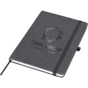 A black A5 notebook with an elastic band and a logo on the cover, featuring a textured finish.
