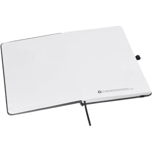 An A5 notebook with a black cover, featuring blank white pages and a recycling symbol on the inside.