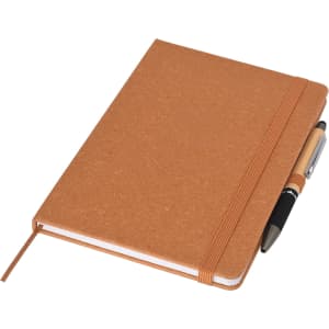 A brown recycled A5 notebook with a pen, secured with an elastic band, featuring a plain cover.