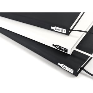 A series of A5 notebooks in black, white, and grey, featuring a logo and an elastic closure.