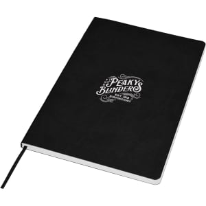 A black A5 notebook with a logo on the cover and a ribbon bookmark. It features a textured finish.