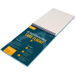 A top-bound A5 notebook with a spiral binding, featuring blank pages and a colourful promotional cover.