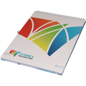 A top-bound A4 notebook with a colourful abstract design and a logo on the cover. Features a spiral binding.