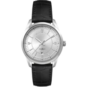A silver watch with a minimalist dial and a black leather strap, featuring a logo on the face.