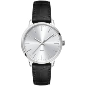 A ladies dress watch featuring a silver dial and a black leather strap, with a sleek, minimalist design.