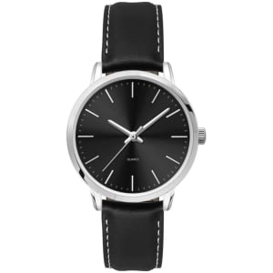 A ladies dress watch featuring a black dial, silver hands, and a black leather strap with white stitching.
