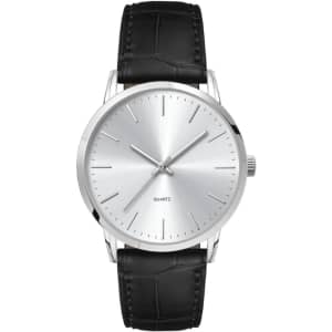 A men's dress watch with a silver dial and a black leather strap, featuring minimalist hour markers and a logo.