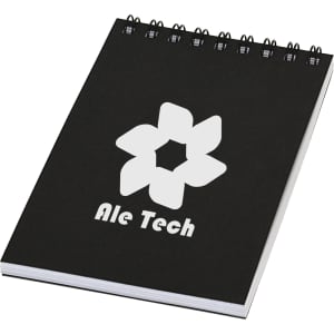 A black spiral notebook with a white logo and branding on the front cover.