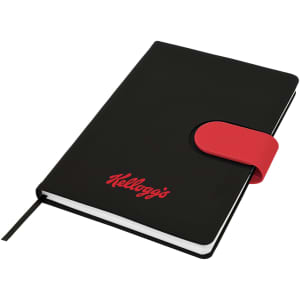 A black A5 notebook with a red elastic strap and a logo. The notebook features a ribbon bookmark and lined pages.
