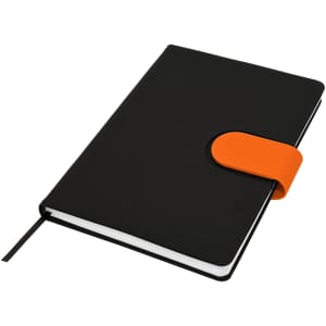 A black notebook with an orange closure, featuring a ribbon bookmark and a branding logo.