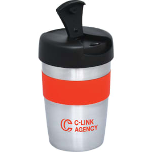A double wall travel mug featuring a silver body, an orange silicone grip, and a black lid with a spout. It has a logo.