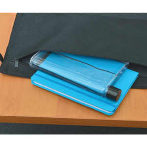 A drink bottle in a clear blue colour sits atop a blue notepad, inside a black bag on a wooden table.