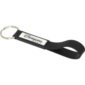 A black silicone keyring with a loop design and a rectangular area for a logo or branding.