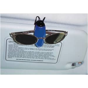 A blue sunglass holder with a pair of sunglasses attached, mounted on a car visor.