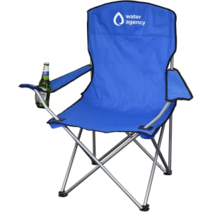 A blue folding chair with armrests and a beverage holder, featuring a logo on the backrest.