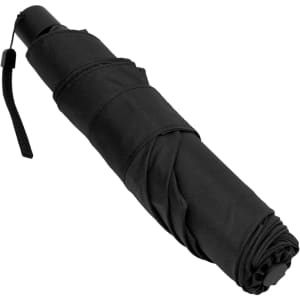 A compact black umbrella, folded and secured with a strap, featuring a logo on its handle.