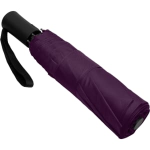 A purple fold-up umbrella with a black handle and a strap. It features a compact design for easy storage.