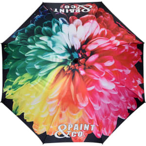 A large umbrella featuring a vibrant floral design in a mix of pink, green, and blue colours, with a logo on it.