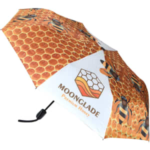 A full colour umbrella featuring a honeycomb design with bees, predominantly in shades of yellow and white. It includes a logo.