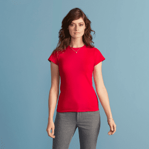 A red Softstyle ladies' T-shirt displayed on a model against a light blue background.