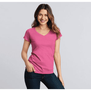 A pink Softstyle ladies' V-neck T-shirt displayed on a model, featuring a simple design and short sleeves.