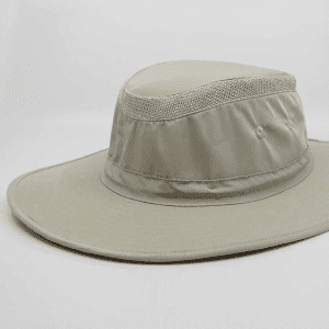 A beige sun hat with a wide brim and mesh detailing, featuring a logo on the band.