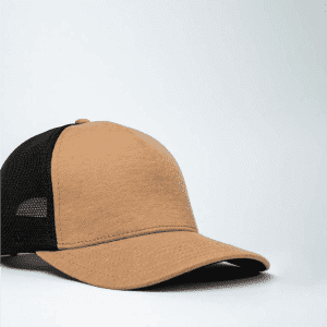 A tan and black trucker cap with a mesh back and a rounded brim. The cap features a logo on the front.