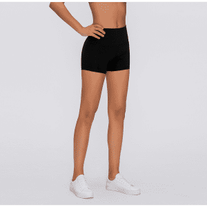 High rise black training spanks with a fitted design, paired with white sneakers. Features a logo.