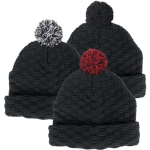 A collection of three black beanies with textured patterns and colourful pom poms—white, red, and black. Each hat features a logo.