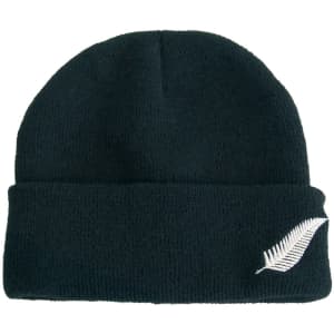 Acrylic beanie in dark green featuring a silver fern design and a logo.