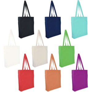 Ten large calico tote bags in various colours, including black, navy, teal, white, cream, green, orange, red, and purple. Each features two handles and a logo.