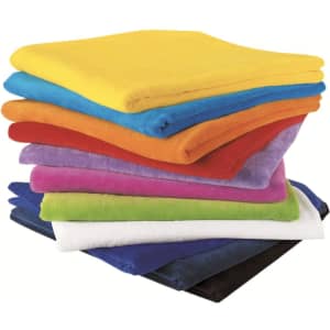 A stack of Terry Velour Towels in various colours including yellow, blue, red, orange, purple, pink, green, white, navy, and black.