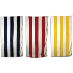 Three striped beach towels in navy blue, red, and yellow, with a logo present on the towels.