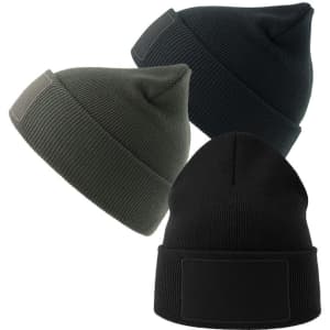 A collection of three beanies in dark green, black, and dark grey, featuring a patch on each.