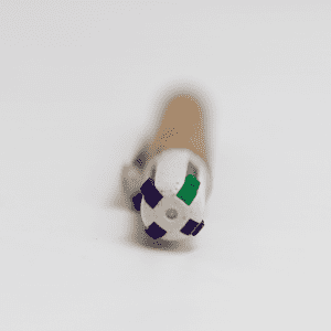 A cork pen with four colour options: blue, green, black, and red, featuring a branded design on the cap.