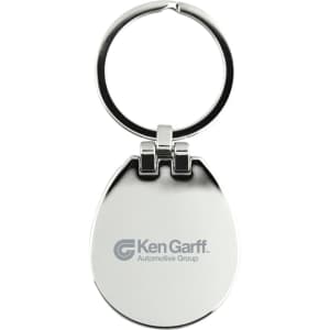 A silver keychain with a circular ring and an egg-shaped body, featuring a logo on one side.