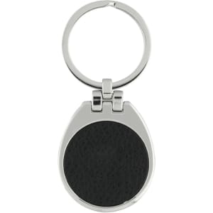 A silver keychain with a round black leather insert and a circular ring for attaching keys.