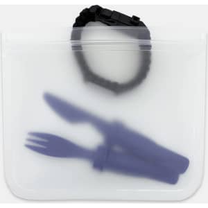 A transparent PEVA reusable food storage bag with a black strap, containing purple utensils inside.
