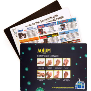A collection of three counter mats, featuring various designs and instructions, predominantly in black and colourful themes.