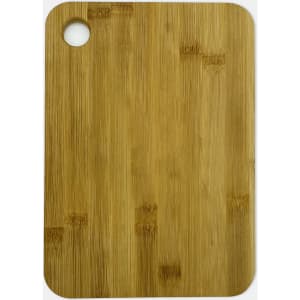 A large bamboo cutting board with a round hole in one corner, featuring a natural light brown finish.