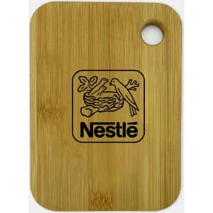 A small bamboo cutting board featuring a circular hole and a logo. The board has a natural wood finish.