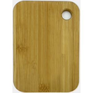 A bamboo cutting board in a rectangular shape with a small hole for hanging.